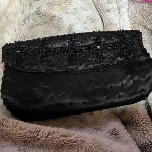 Evening clutch hand bag. Black silky material with hand beading.  8-H7B